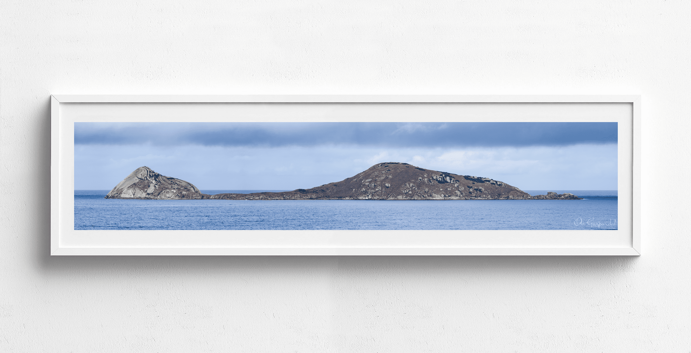 Norman Island 1-5 L White Frame on small wall.