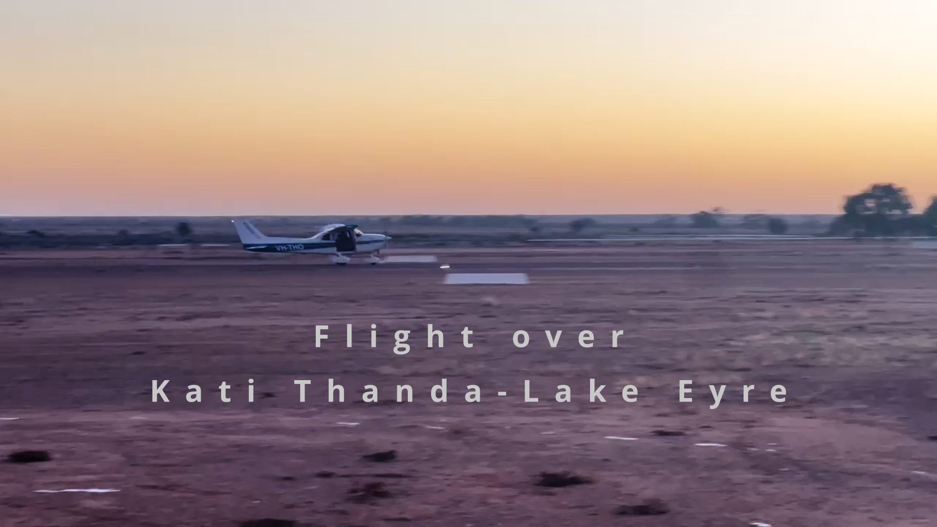 william creek airstrip, cessna 172 taking off, early morning light