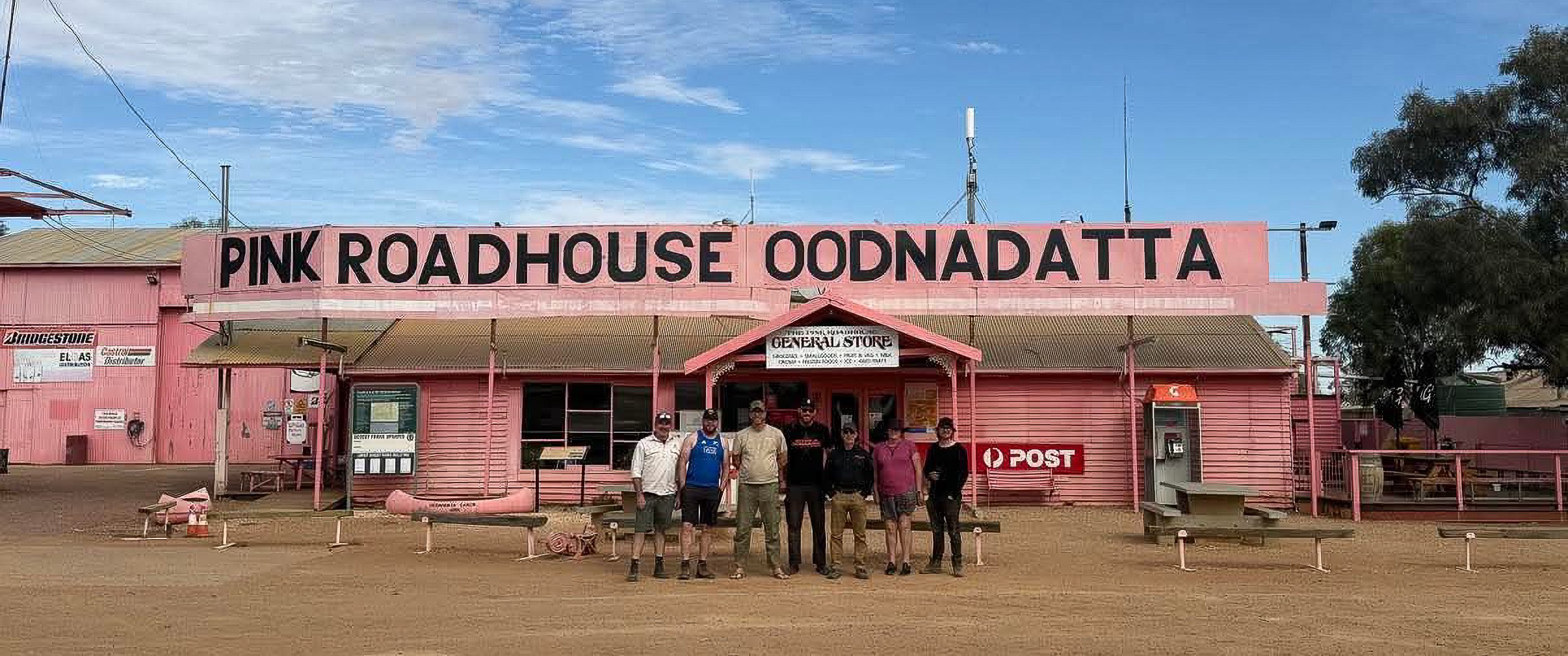 The travelling companions in front of the Pink Roadhouse in Oodnadatta