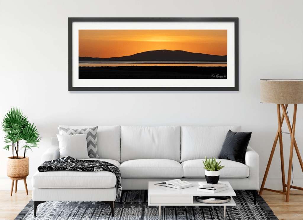Yanakie Sunrise landscape print shown in a black frame on a living room wall — Artwork Placement Preview by Ola Garpendal Photography